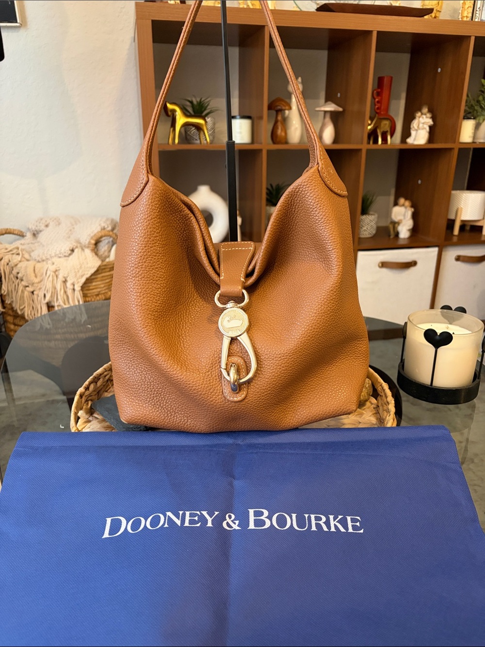 Dooney and Burke pebble grain small logo loc sac in caramel gold hardware